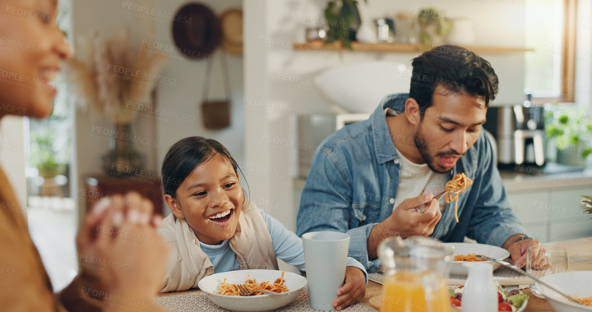 Buy stock photo Happy, family and lunch with juice at a table, hungry and a child excited for a drink. Smile, interracial and a mother, father and girl kid eating and enjoying dinner or breakfast together in a home