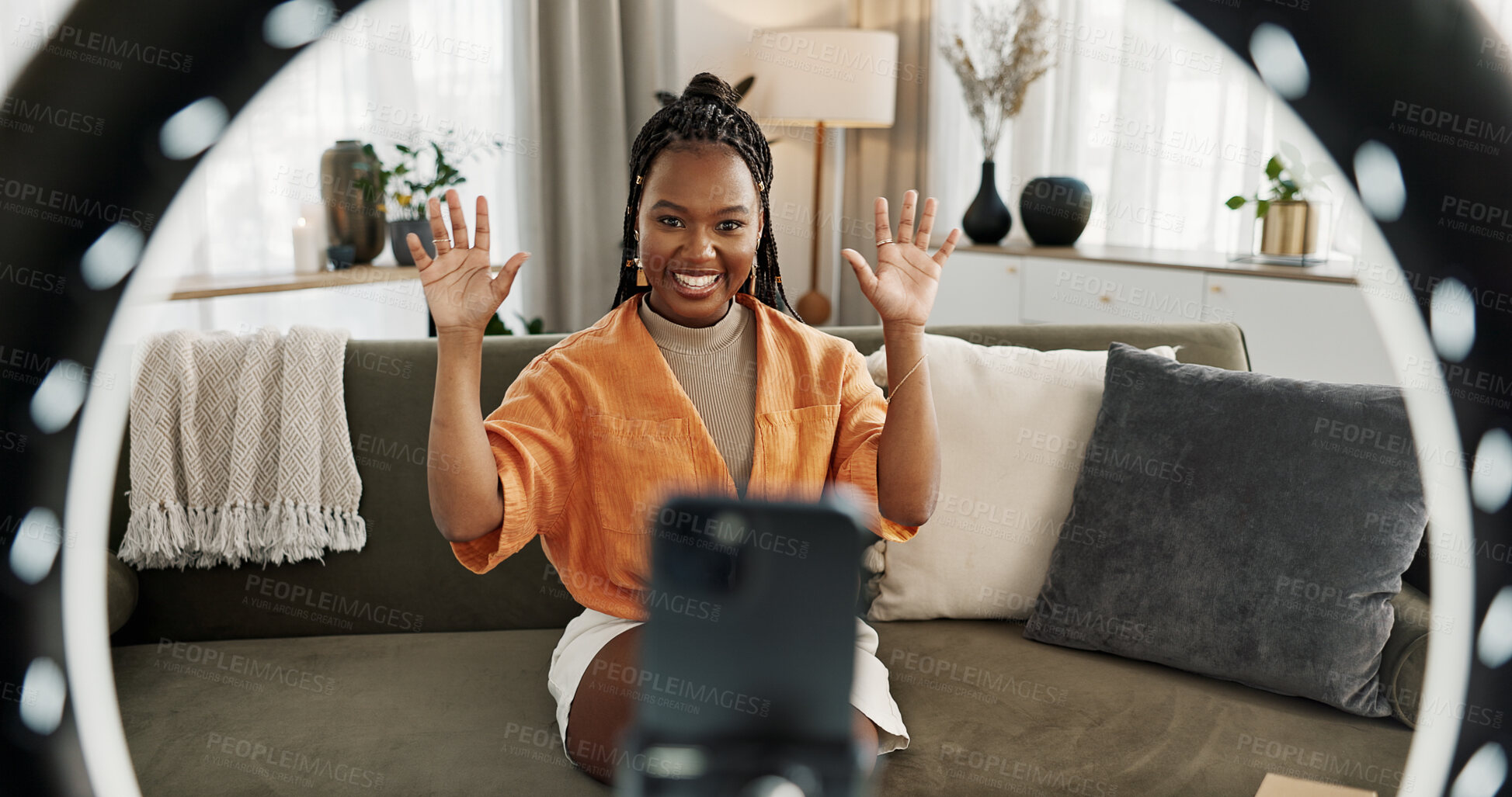 Buy stock photo Wave, live streaming and happy black woman with box or product in home living room. Hello, influencer and person with package, record video on social media and content creation, ring light and phone