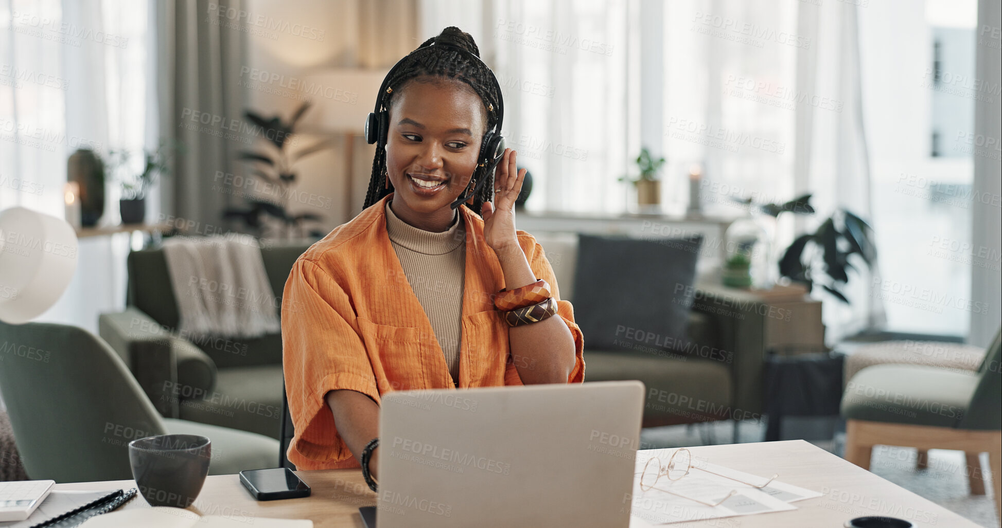 Buy stock photo Black woman, headset in home office with laptop and phone call, remote work and crm in apartment. Virtual assistant at desk with computer, typing and conversation for advice, online chat and support