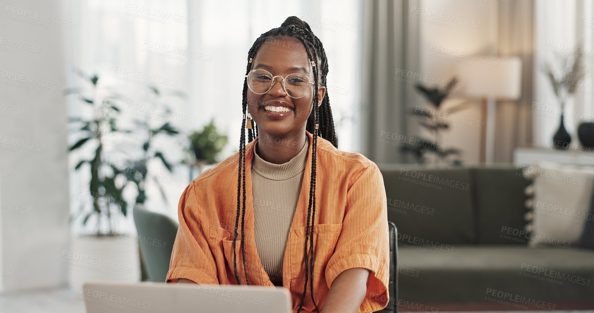 Buy stock photo Black woman, portrait in home office and laptop for remote work, social media or blog research with smile in apartment. Happy freelancer at desk with computer for email, website or online in house.