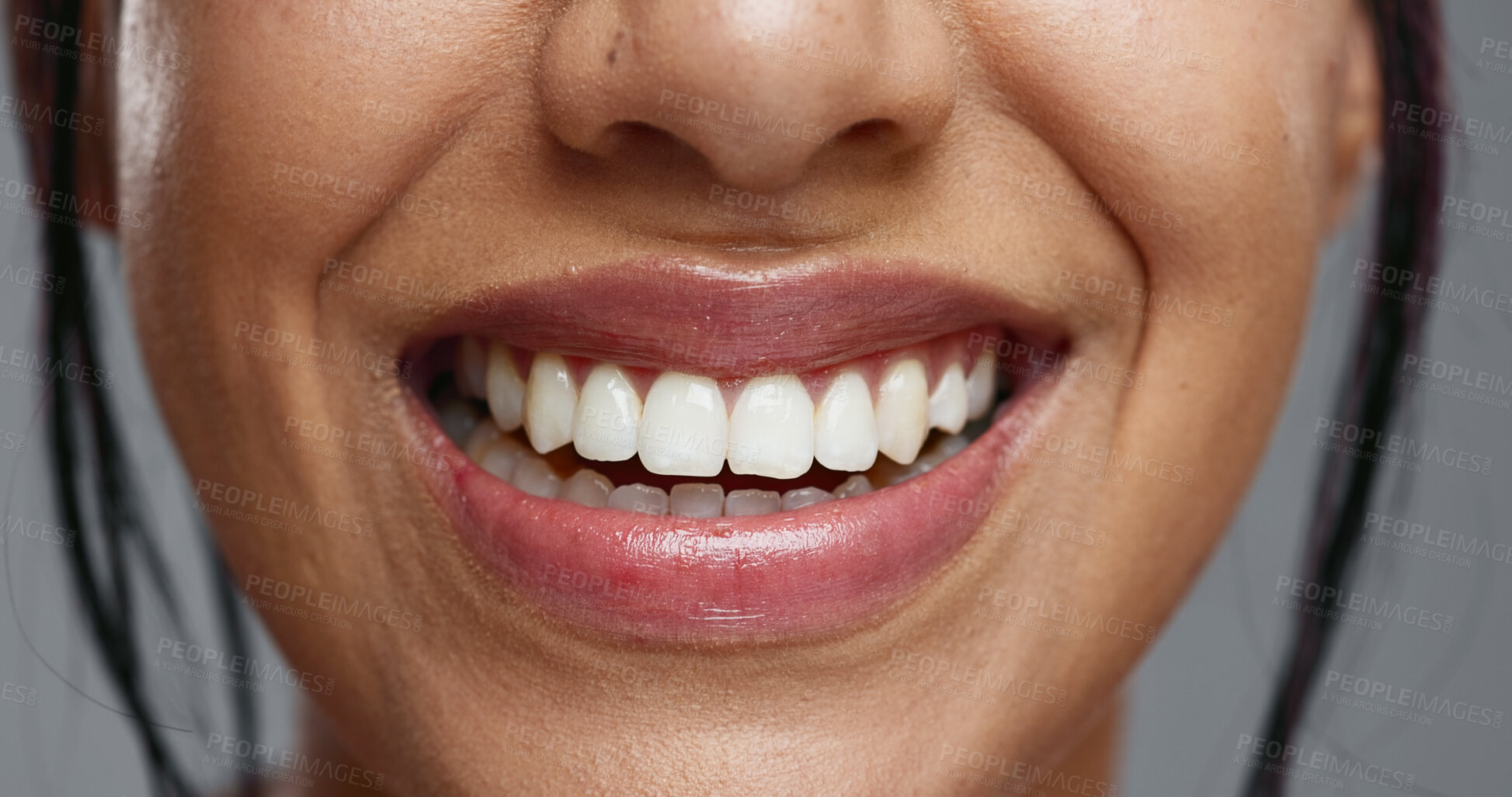 Buy stock photo Woman, mouth and closeup in studio for dental wellness, beauty and change with cosmetics by background. Girl, teeth whitening and smile for cleaning, health and zoom for oral care with hygiene