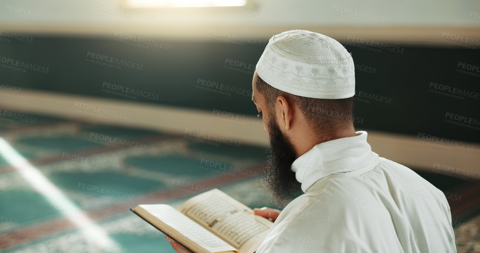 Buy stock photo Islamic man, kiss quran and mosque for faith, reading or mindfulness with worship, praise or back for study. Muslim person, religion and peace in book, prayer or thinking with meditation in Palestine