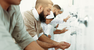 Muslim, religion ritual and men washing before prayer in bathroom for purity, and cleaning. Islamic, worship and faith of group of people with wudu together at a mosque or temple for holy practice