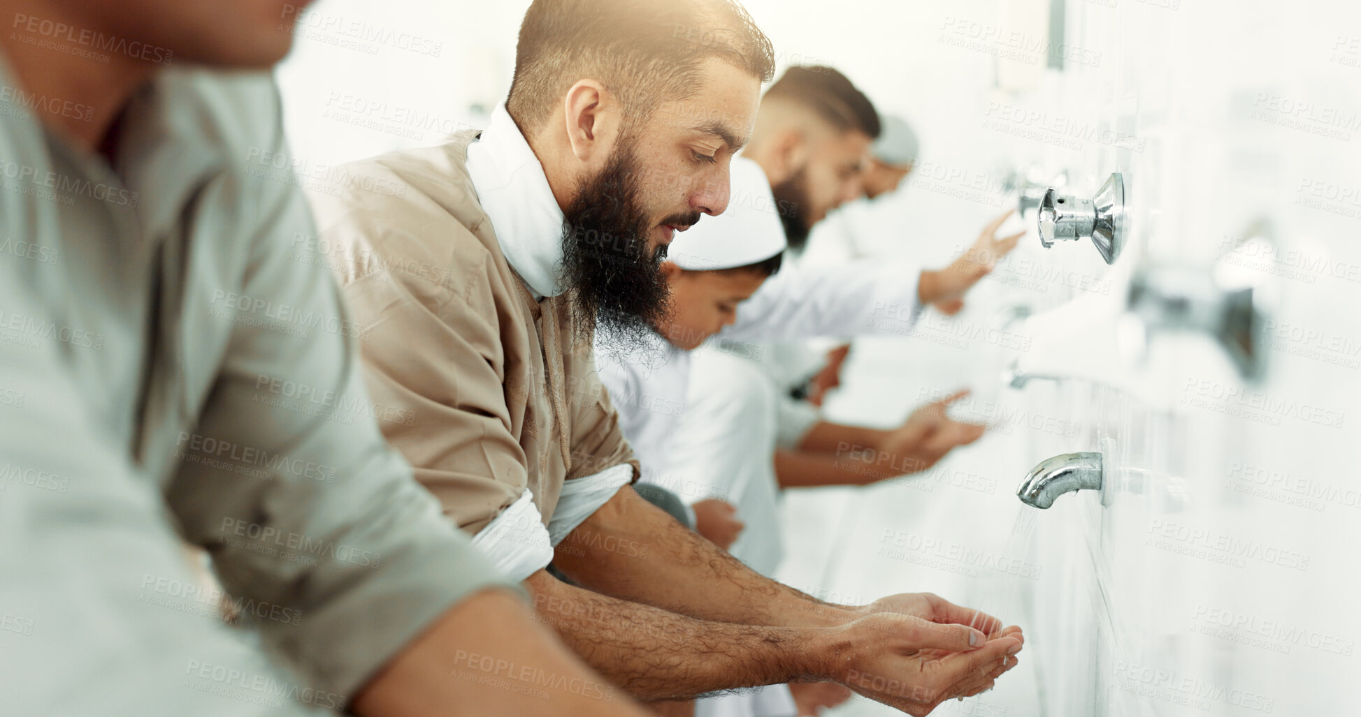 Buy stock photo Muslim, religion ritual and men washing before prayer in bathroom for purity, and cleaning. Islamic, worship and faith of group of people with wudu together at a mosque or temple for holy practice