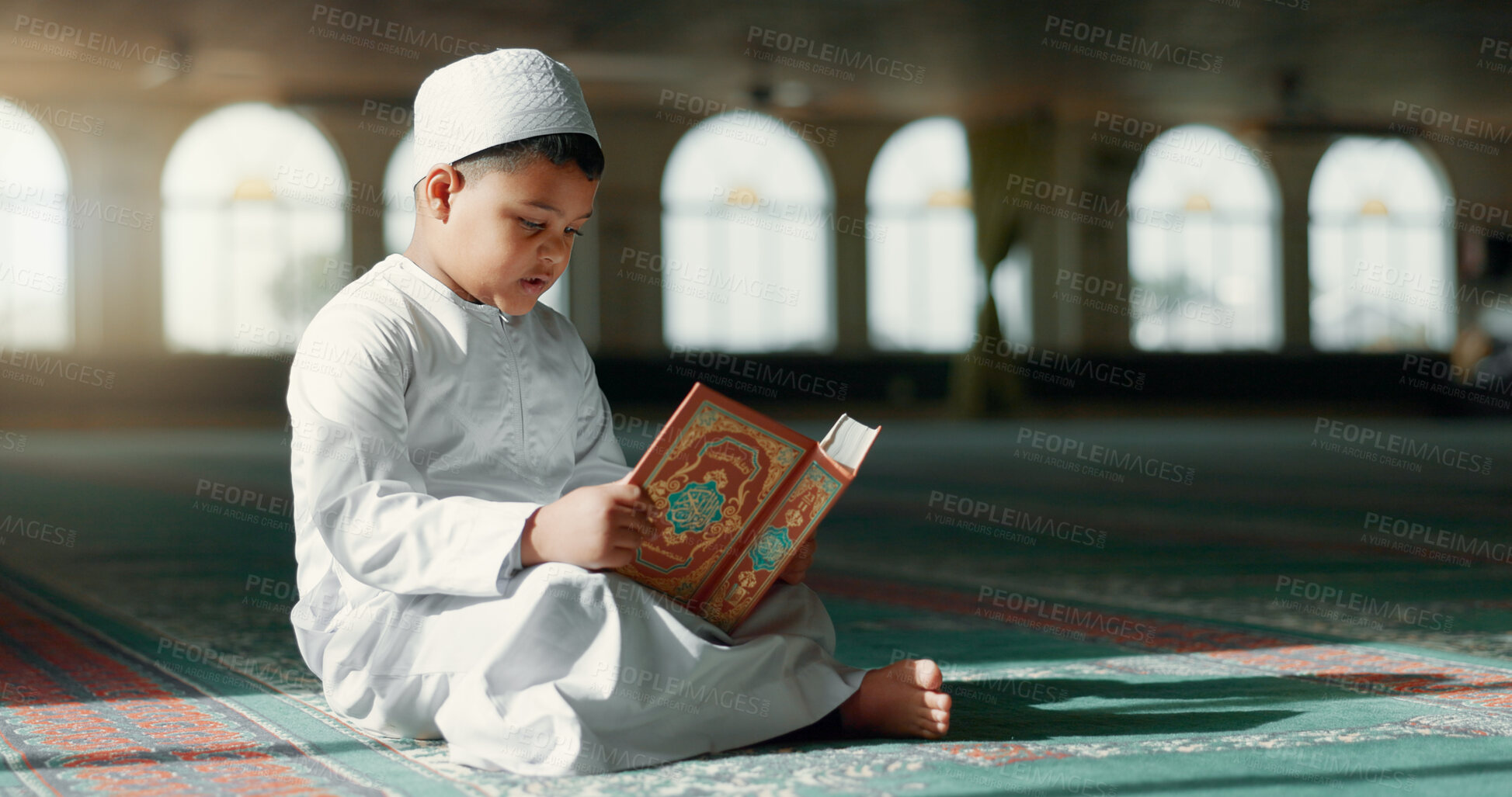 Buy stock photo Islam, boy in mosque reading Quran for learning mindfulness and gratitude in faith with kids prayer. Worship, religion and Muslim student in holy temple praise with book, spiritual teaching and study