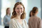 Woman, employee and business portrait in an office for management, entrepreneur and corporate planning. Confident, female executive smiling or happy for marketing, strategy or leadership in workplace