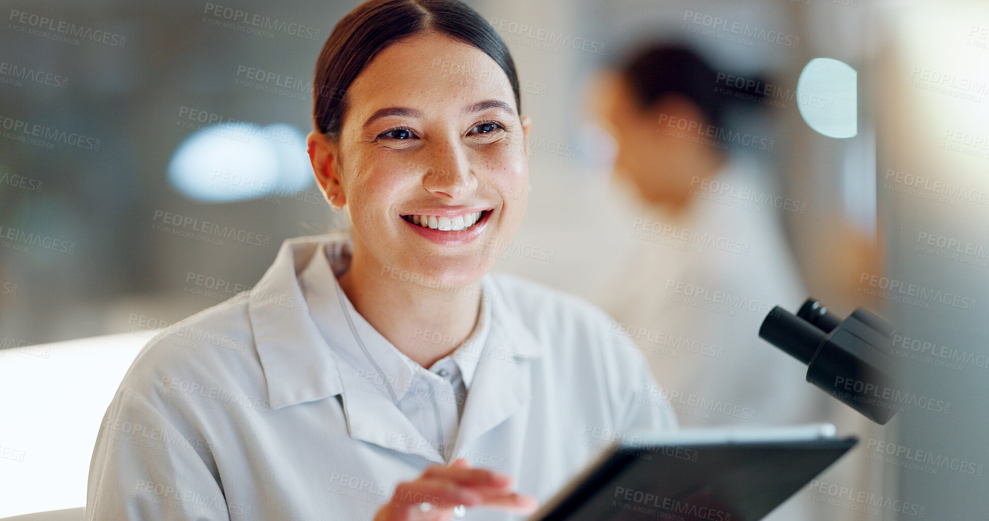 Buy stock photo Scientist, woman and tablet, microscope or laboratory research for DNA analysis and happy with medical study. Student or science expert in biotechnology with digital software and lens check for data