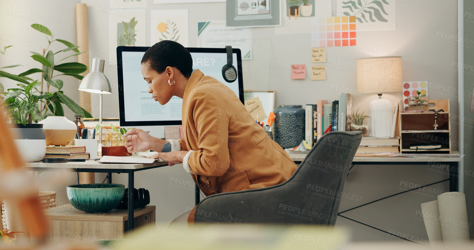 Buy stock photo Planning ideas, office and a black woman with a notebook for business, project inspiration or goals. Workspace, notes and an African employee writing notes about work information, schedule or agenda