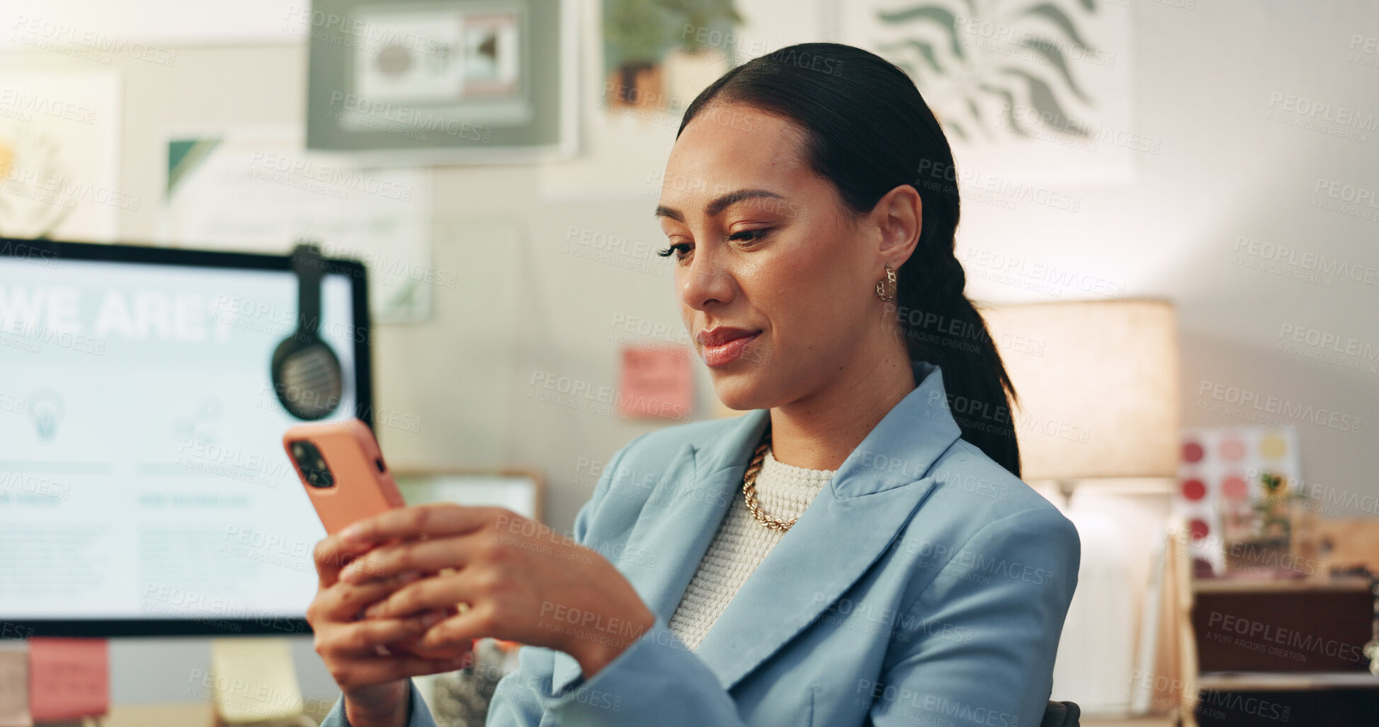 Buy stock photo Phone, happy and businesswoman in the office typing a text message on social media or the internet. Smile, technology and professional female creative designer scroll on cellphone in the workplace.