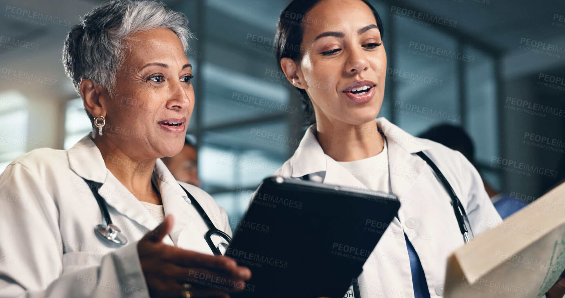 Buy stock photo Doctor, women together and tablet with documents, night or analysis for results, decision or info in hospital. Mature medic, partnership and paperwork for healthcare, wellness or planning with choice