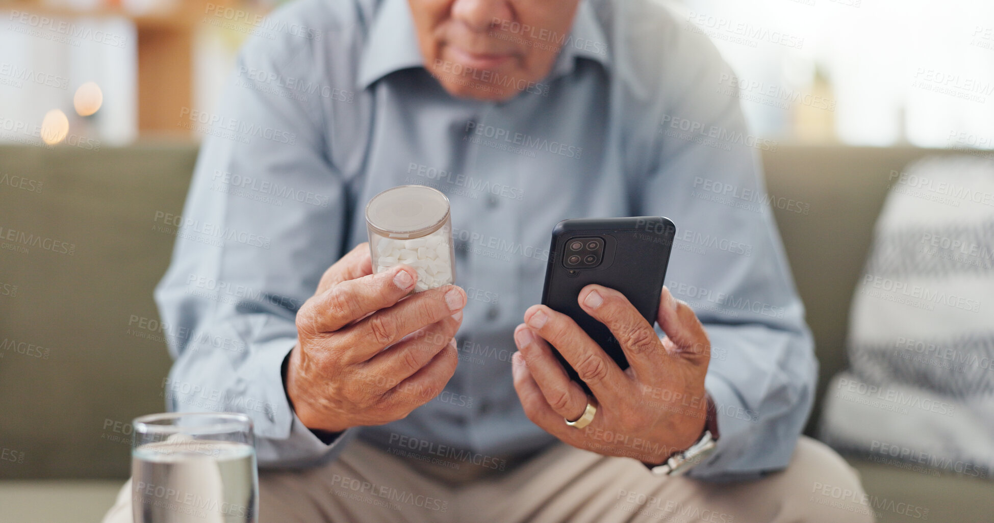 Buy stock photo Phone, medicine and mature hands with home research, reading label and learning of telehealth services. Online person with pills bottle, tablet and mobile for safety and health benefits on the sofa