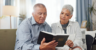 Senior, couple and home reading bible and talking of faith, god or helping with spiritual guide of scripture on sofa. Elderly man, pastor and christian woman with holy book for religion and support