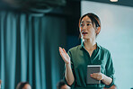 Businesswoman, conference or speaker sharing information at a business seminar for knowledge, motivational or coaching. Confident, woman or coach speaks to audience at a convention or corporate event