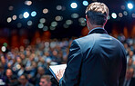 Businessman, conference or speaker sharing information at a business seminar for knowledge, motivational or coaching. Confident, man or coach speaks to audience at a convention or corporate event