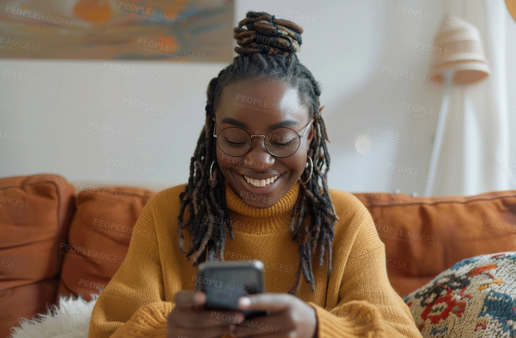 Buy stock photo Smartphone, couch and woman typing a message for social media marketing, business or networking. Cheerful, young and African female texting friends or colleagues for content creation and scrolling