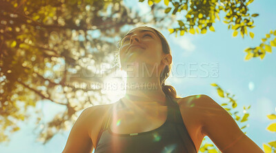 Woman, breathe and break after an intense workout for exercise, training or fitness. Fit female, confident smile and happy laughter after an intense run for challenge, mental health and wellbeing