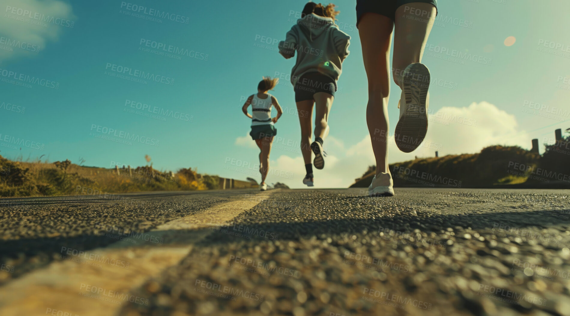 Buy stock photo Group, running and athlete exercise on an open road for marathon competition, training or jogging workout together. Low angle, sunrise and sport shoes mockup for challenge, activity or team support