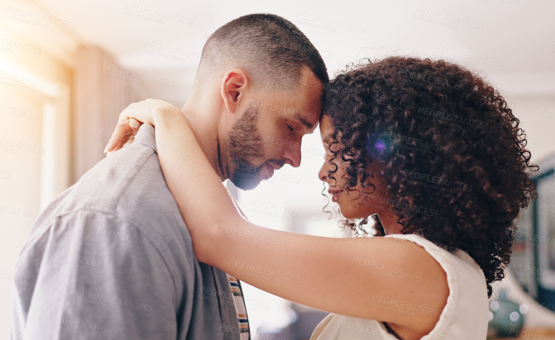 Buy stock photo African couple, dance and smile in home with hug, conversation and care with bonding in apartment. Man, woman and dancer with embrace, love and comic chat with laugh, funny memory or happy in house