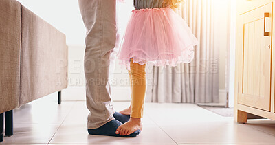 Father, child and dancing on feet in living room, modern home and music or radio with love. Dance, energy and girl in ballerina dress by man bonding and standing with daughter in apartment with care