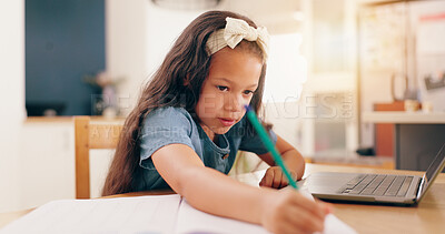 Girl, learning and writing with pencil, homework and book for development, knowledge and thinking at desk. Child, student and notebook by laptop for education, problem solving or notes in family home
