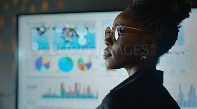 Charts, business or woman in an office for marketing strategy, data analysis and infographics on screen. Happy, confident and American looking at a big screen for finance, professional or technology