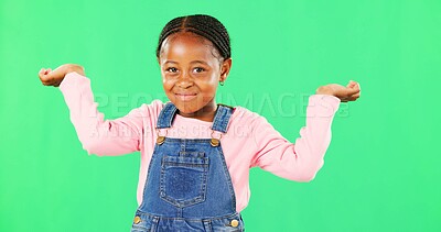 Little girl, face and clueless with smile on green screen for question against a studio background. Portrait of African American child or kid smiling with arms in air, unsure or doubt on mockup