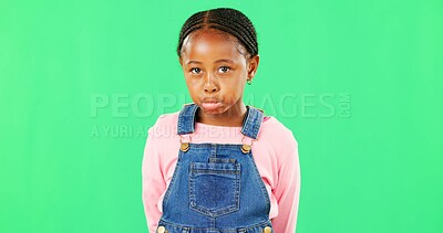 Sad, expression and face of a child on a green screen isolated on a studio background. Depression, unhappy and portrait of an African girl kid looking moody, disappointed and expressing sadness