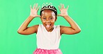 Children, playful and princess with a black girl on a green screen background in studio feeling silly or goofy. Kids, cute and happy with an adorable little girl playing or having fun on chromakey