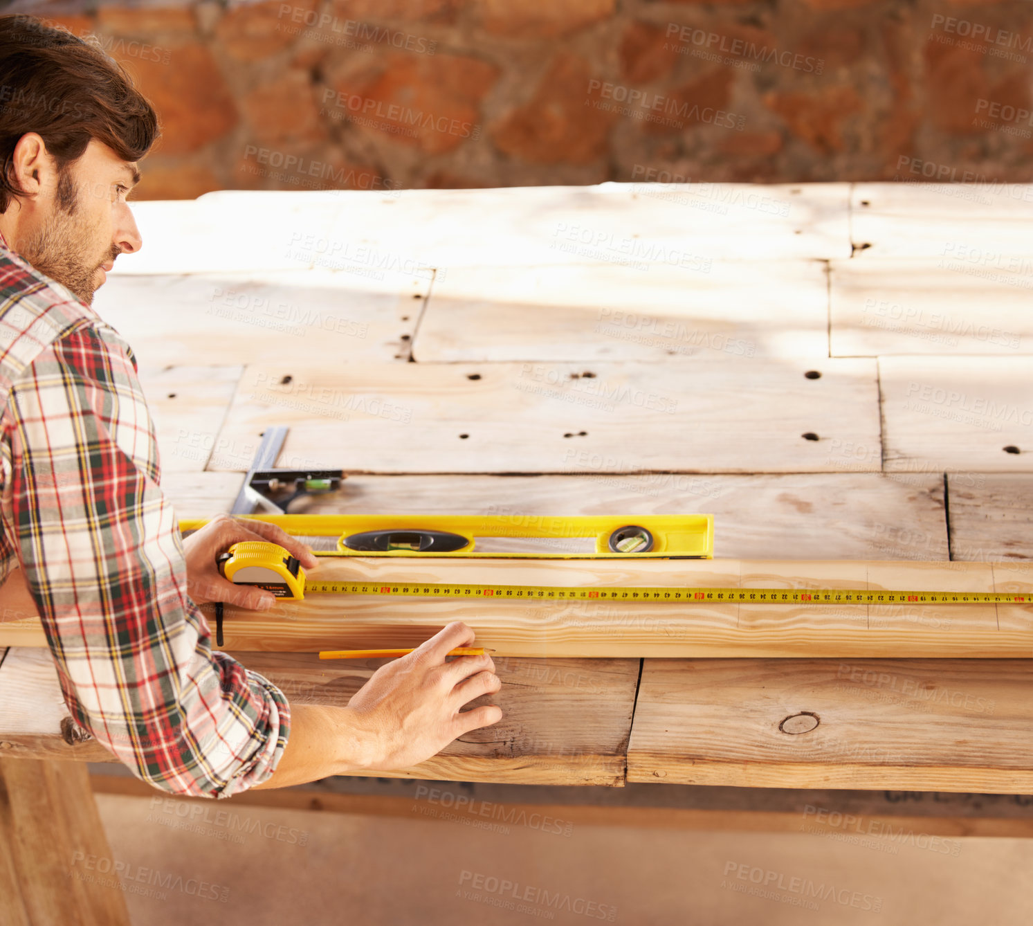 Buy stock photo Handyman, marking and measuring tape on wood in workshop, home repairs and professional with plan. Person, working and handcraft with maintenance, job and career in industry, skill and technique 