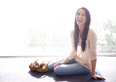 Buy stock photo Woman, university and student with laugh for sitting on floor with backpack, campus and break for joke. Female person, education and college with happiness for fun, enjoy and academics to relax