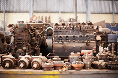 Buy stock photo Recycle, scrap metal and rust in workshop at junkyard for sorting, garbage and at trash at landfill site. Steel, iron factory and engine parts on table in plant with mechanic machine at waste dump.