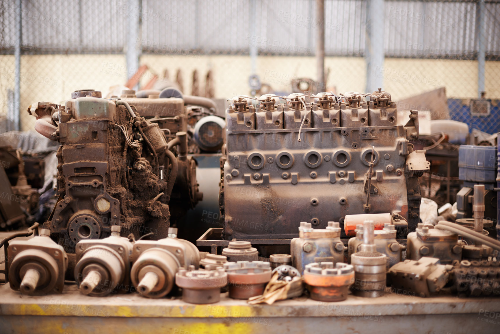 Buy stock photo Recycle, scrap metal and rust in workshop at junkyard for sorting, garbage and at trash at landfill site. Steel, iron factory and engine parts on table in plant with mechanic machine at waste dump.