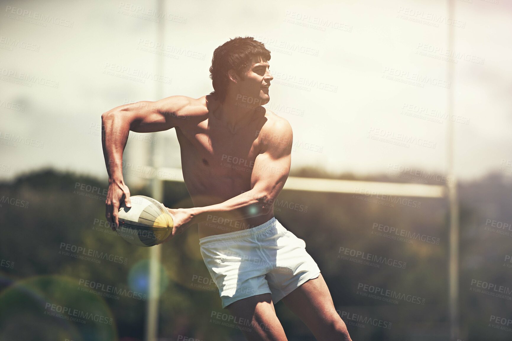 Buy stock photo Rugby, sports and fitness man with ball on field for training, wellness or morning cardio outdoor. Handball, exercise and topless male player running at stadium for competition, action or performance