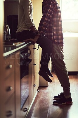 Buy stock photo Cropped shot of young couple sharing a romantic moment in the kitchen