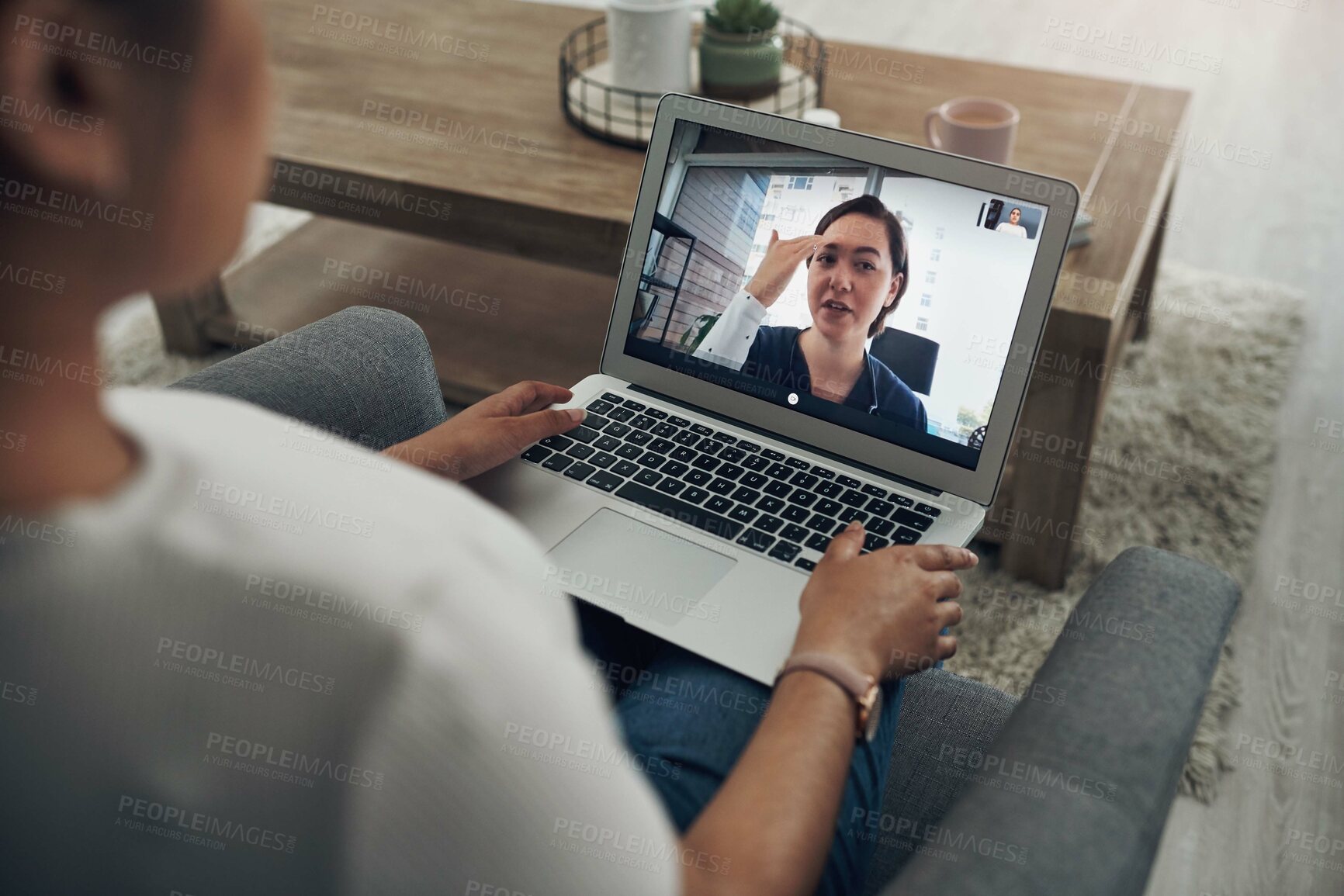 Buy stock photo Shot of an unrecognizable person on a videocall with a doctor