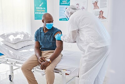 Buy stock photo Patient getting covid vaccine, injection and cure from a doctor in a clinic. Man with plaster bandage on arm after flu jab, antiviral shot and health treatment to boost immunity and prevent illness