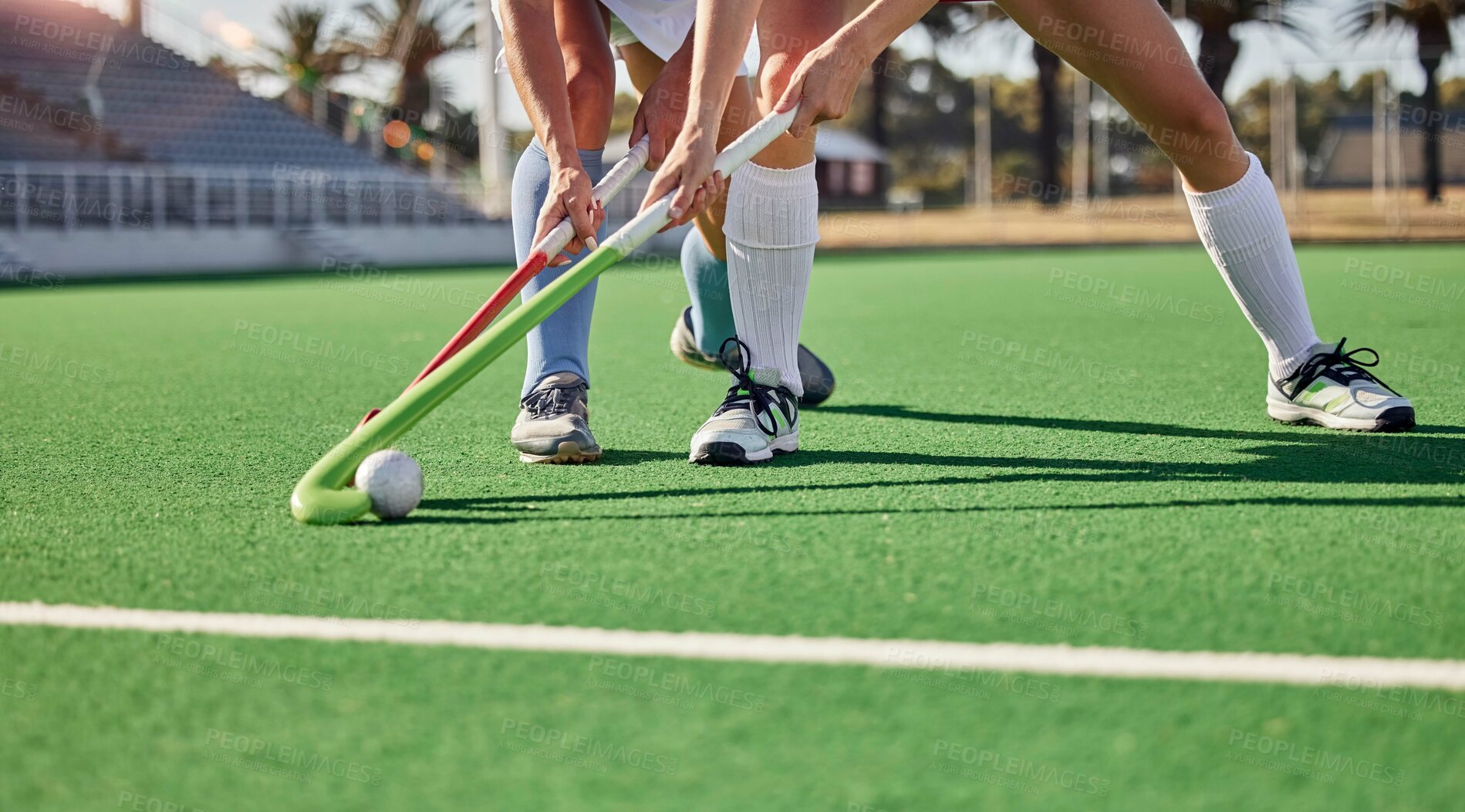 Buy stock photo Hockey, field and athletes playing a game at a championship or sports training at an outdoor stadium. Fitness, action and team with sticks and a ball doing a exercise or skill on a sport turf court.