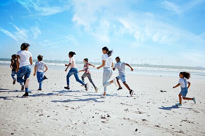 Buy stock photo Running family, beach and adoption kids with happiness, bonding and sand with speed on summer vacation. Women, children and happy workout for group on holiday by ocean with diversity, love and care