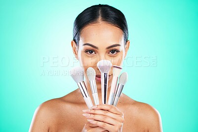Buy stock photo Makeup, brush and portrait of woman in studio for beauty, skincare or grooming on green background. Face, skin and girl model relax with glamour tool, product or luxury makeover on isolated mockup