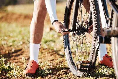 Buy stock photo Man, hands and mountain bike wheel repair in park for training, triathlon sports gear and workout exercise. Cyclist, bicycle and check tire chain for travel safety, cycling maintenance and fixing hub