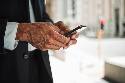 Buy stock photo Hands, phone and navigation with a business man in the city using an app to search for a location or direction. Mobile, travel and communication with a male employee typing a text message closeup