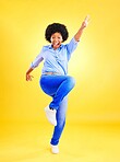 Excited, happy and a woman in studio with fun energy, positive attitude and action. Portrait of African model person isolated on yellow background for freedom dance, winner or celebration of success