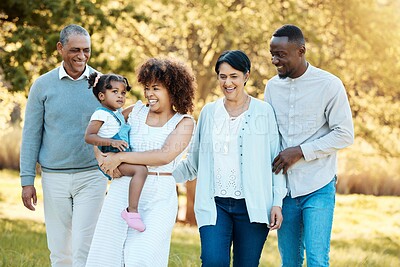 Buy stock photo Nature, walking and family generations in a park for bonding, having fun and talking together. Happy, smile and child with her parents and grandparents in an outdoor green garden on a weekend trip.