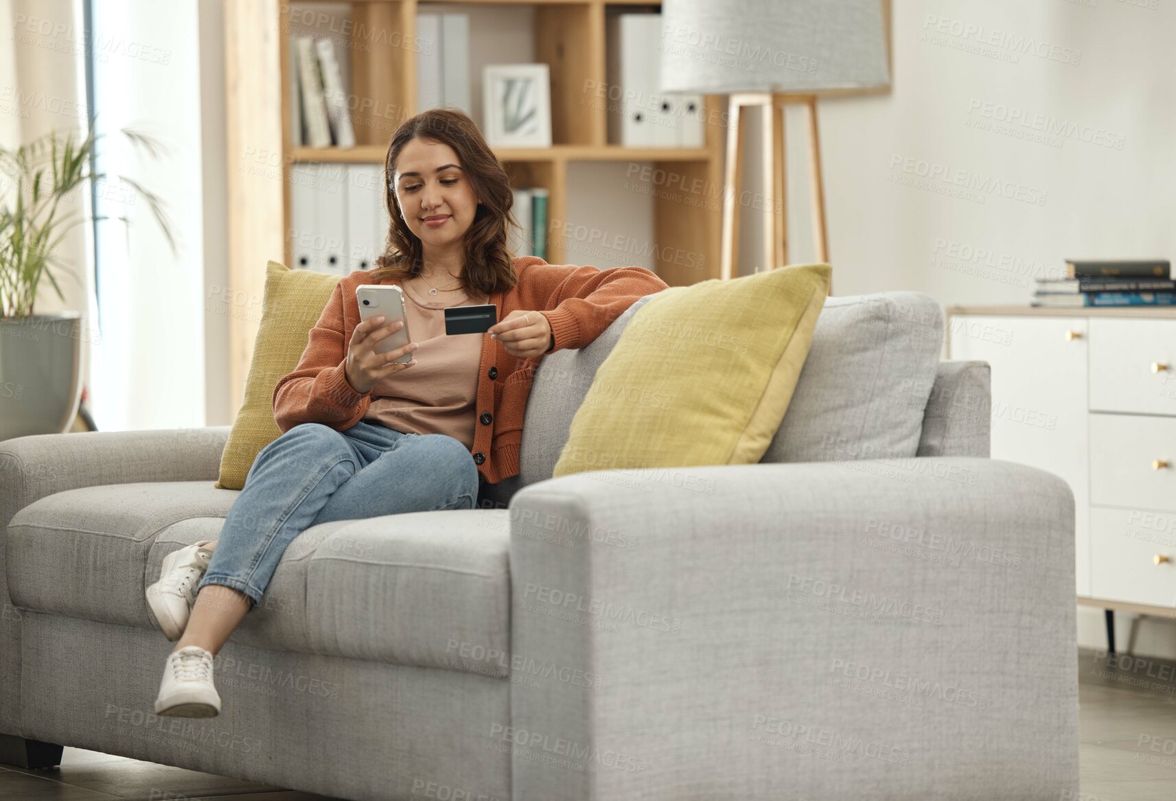 Buy stock photo Home, woman and smartphone with credit card, ecommerce and online banking in a lounge. Person, savings or girl on a couch, cellphone and digital app with payment, finance and transaction with fintech