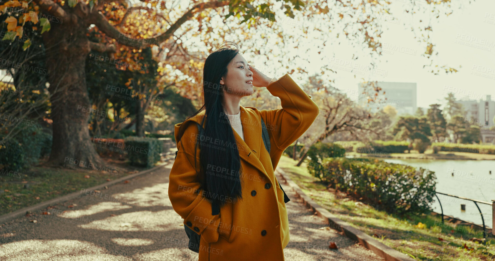 Buy stock photo Woman, thinking and walk in Japanese park with smile in woods for travel on vacation, adventure and explore path. Gen z, student and happy on holiday in nature, forest and trail with trees in Kyoto