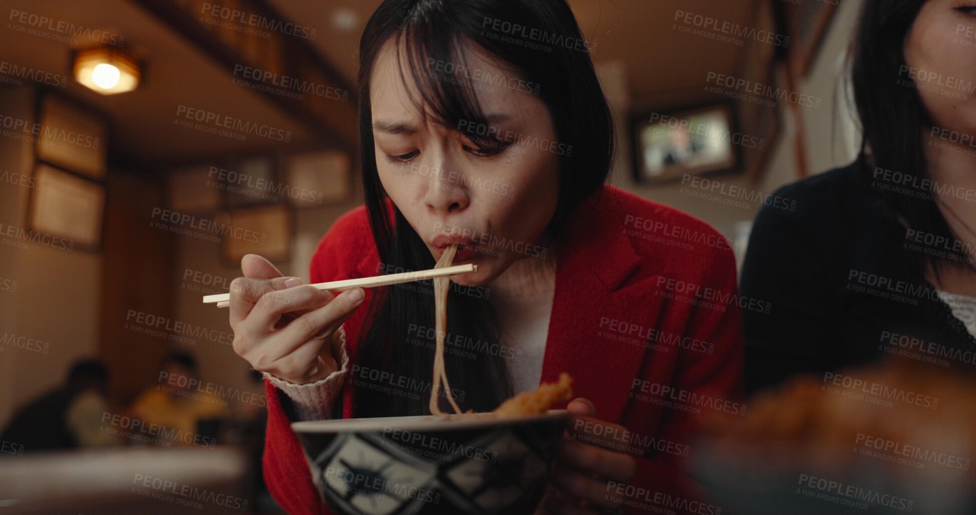 Buy stock photo Woman, restaurant and eating ramen noodles for nutrition, gourmet dining or meal with friends. Hungry lady, chopsticks or spaghetti for lunch, dinner or Japanese cuisine, fast food diner or cafeteria