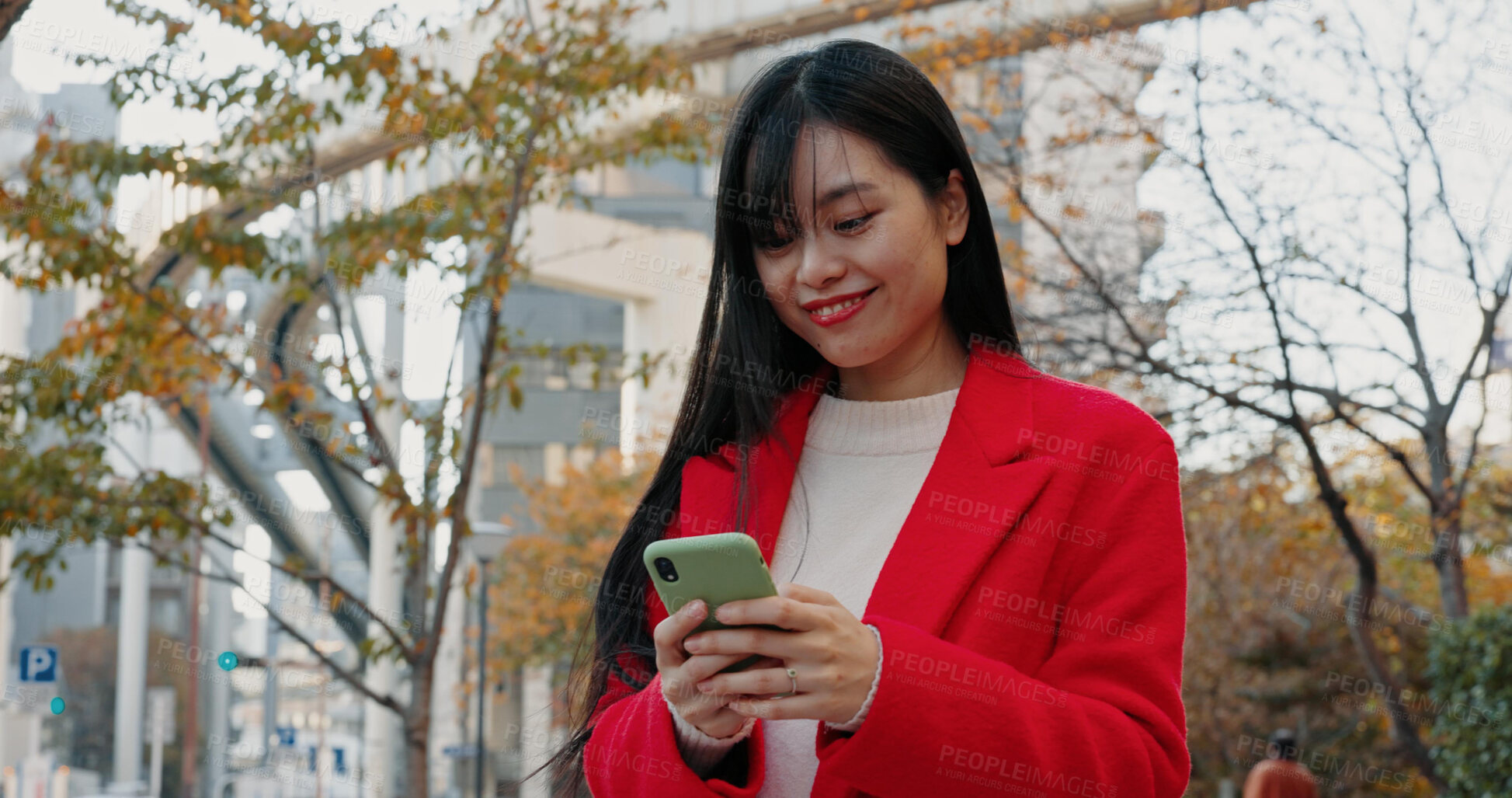 Buy stock photo Happy Japanese woman, city and phone for typing on social media, scroll mobile notification or download digital app. Commuter, smartphone or search online for travel location in urban street of Tokyo