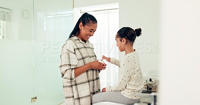 Family, cream and mother with girl in bathroom for skincare, wellness and hygiene at home together. Love, beauty and happy mother and child with lotion, creme and moisturizer for cleaning and washing