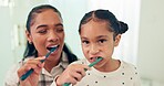 Brushing teeth, mother and daughter with toothbrush and dental for health, morning routine and happy face. Healthy, hygiene and portrait, woman and young girl, oral care and cleaning mouth at home