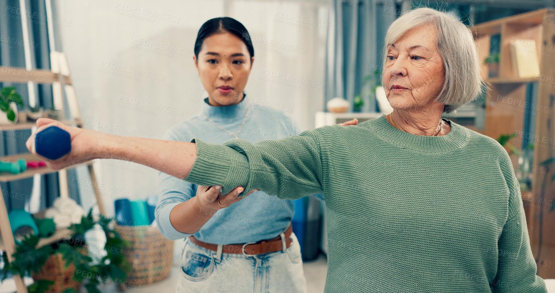Buy stock photo Senior care, therapy and physiotherapist with old woman, dumbbell and healthcare for fitness. Physio, rehabilitation and retirement with training, caregiver with elderly patient for mobility exercise